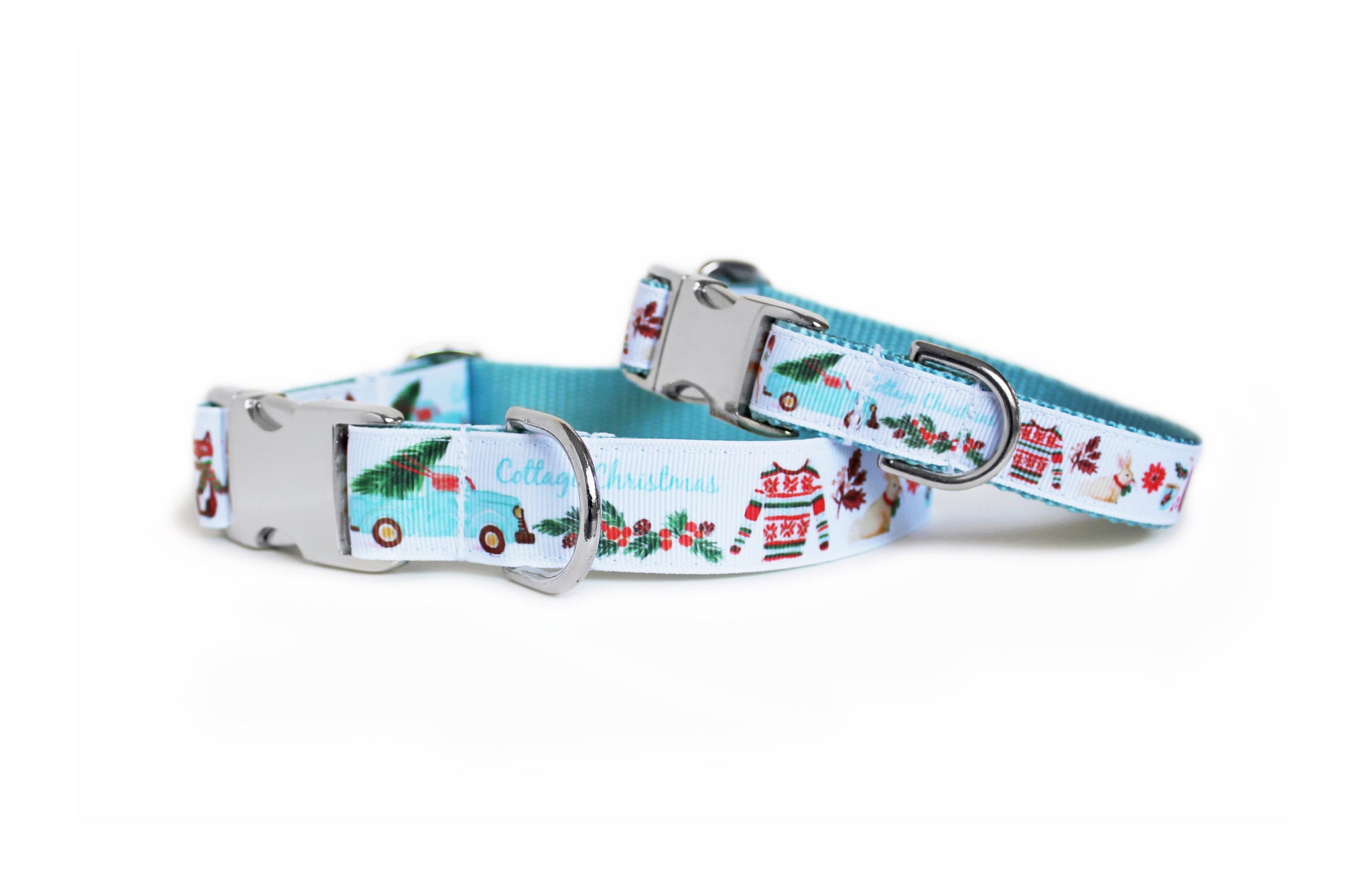 Christmas dog collar with light aqua blue webbing and white trim with cottage illustrations, including a mug of hot chocolate, a Christmas sweater, and a bunny with a ribbon around its neck.