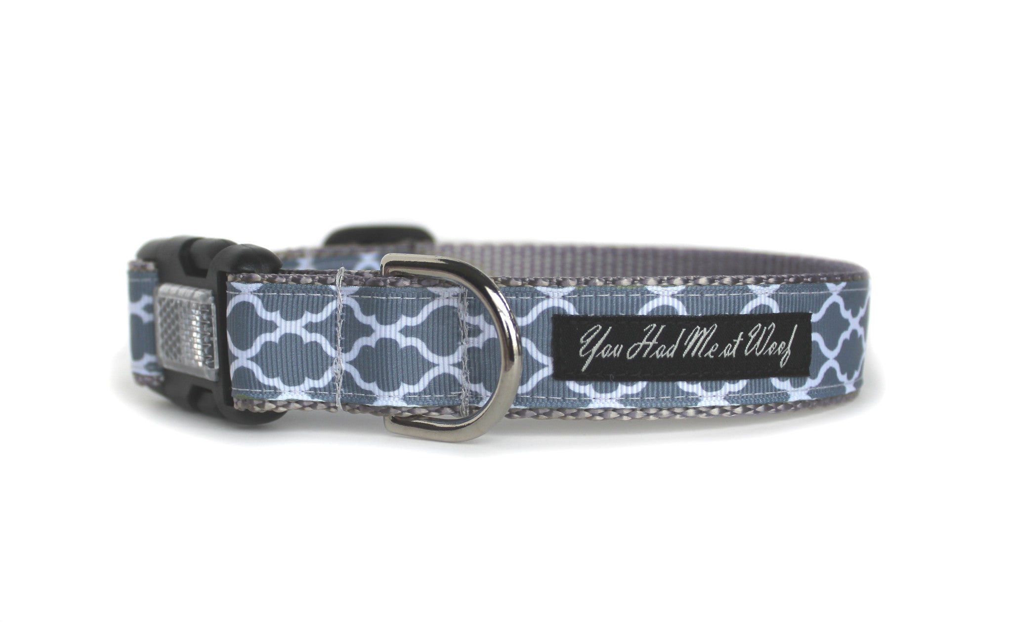 The Cottage Trellis Dog Collar in gray with elegant white quattrefoil design, featuring an optional reflective quick release buckle.
